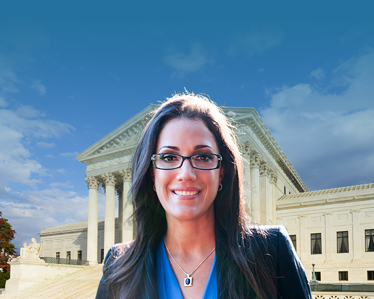 Susan J. Clouthier stands with the Supreme Court of Justice in the background